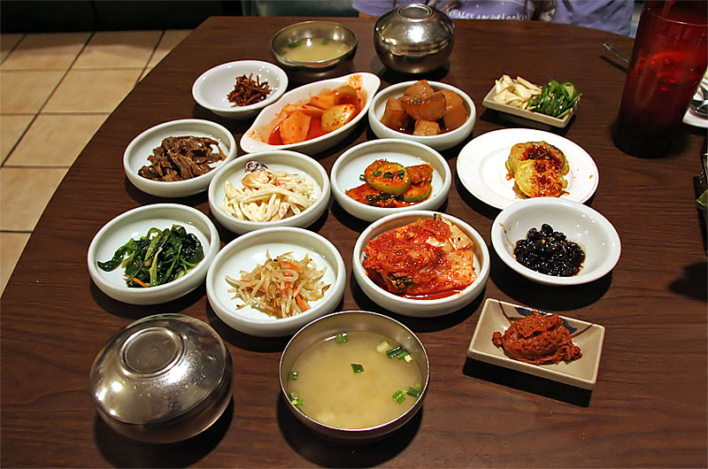 Korean side dishes on our table awaiting the main dish