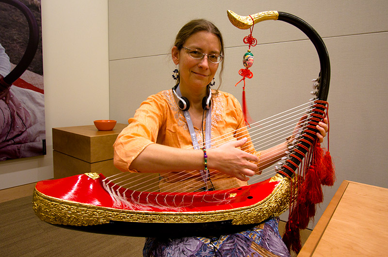 Caroline holding a Burmese Harp at the Musical Instrument Museum in Phoenix, Arizona