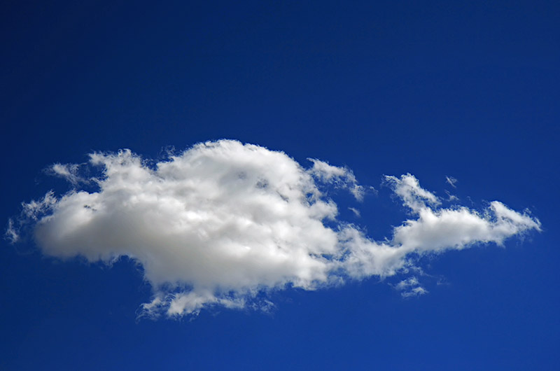 Little white cloud in a deep blue sky over Phoenix, Arizona