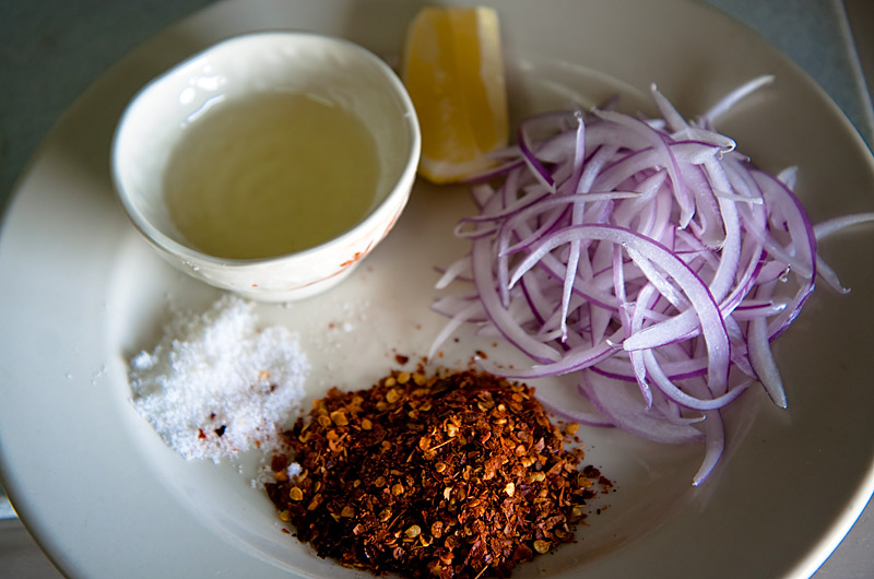 Oil, lemon, onion, chili, and salt are the simple ingredients that make this Burmese salad