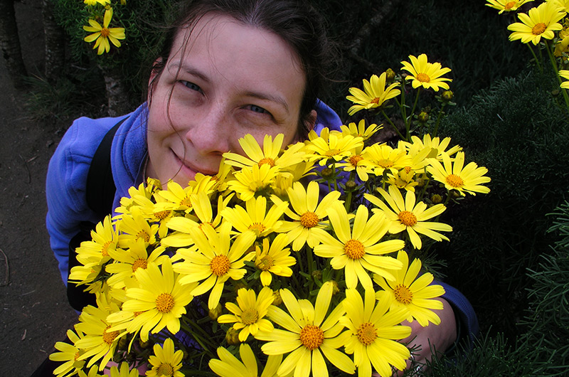 Caroline Wise posing with flowers on Anacapa Island in the Channel Islands during 2004