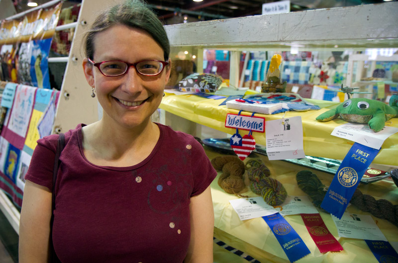 Caroline Wise at the Maricopa County Fair in Arizona where she won three ribbons in crafting for 2 skeins of yarn she spun and a shawl she knitted.