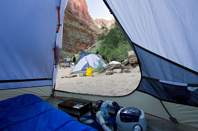 CPAP equipment including battery inside tent at camp site next to the Colorado River in the Grand Canyon