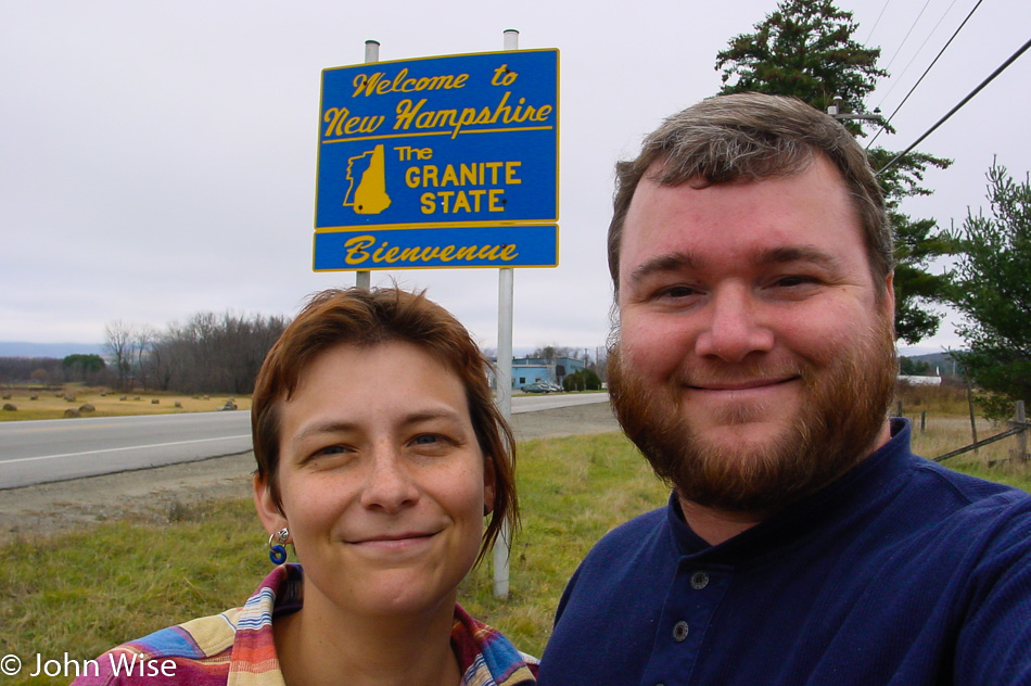 Caroline Wise and John Wise at the Welcome to New Hampshire state sign
