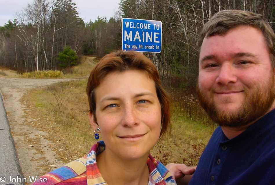 Caroline Wise and John Wise at the Welcome to Maine state sign