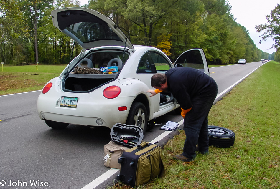 John Wise changing a tire on the Natchez Trace Parkway in Mississippi