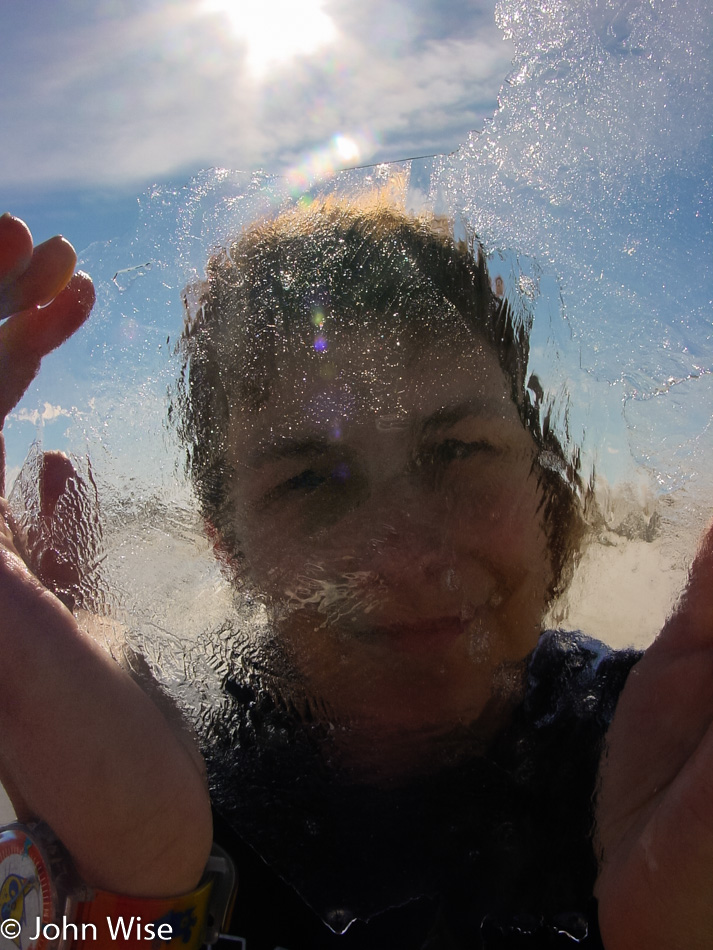 Caroline Wise looking through a piece of ice at White Sands National Monument, New Mexico