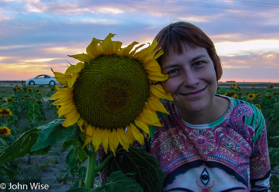 Caroline Wise and a giant sunflower in Nebraska