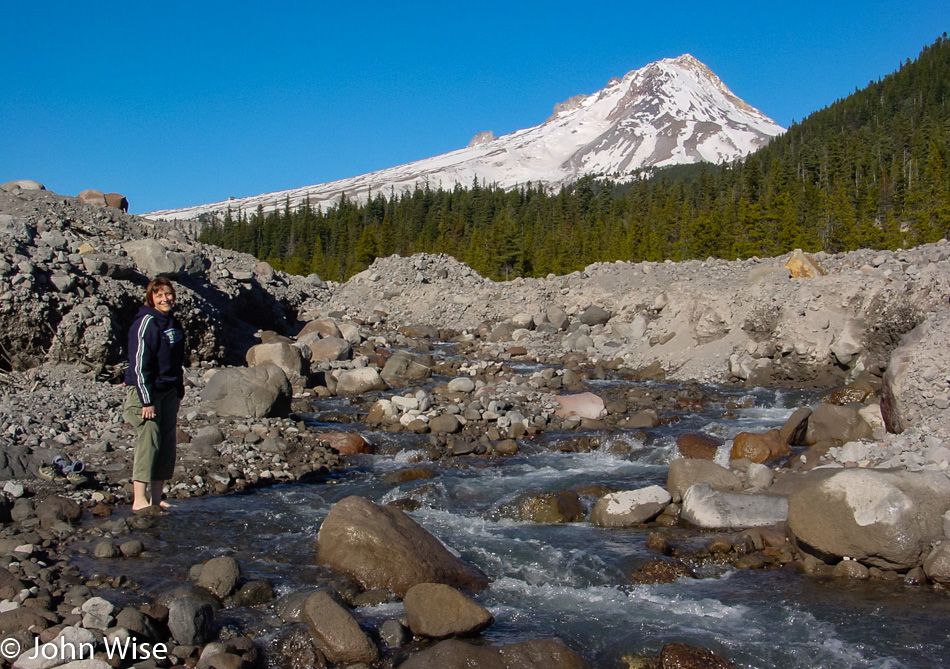 Caroline Wise standing in a mountain stream below Mount Hood, Oregon