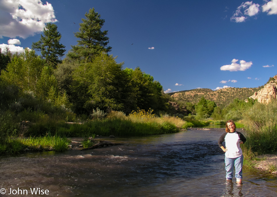 Caroline Wise standing in the Gila River in New Mexico