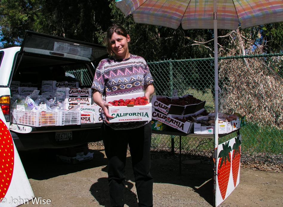 Caroline Wise on Mulholland Drive buying a box of strawberries in California