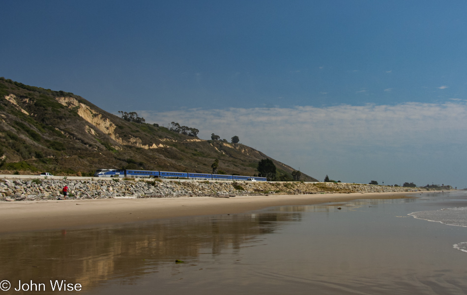 Train running up the coast near Seacliff, California