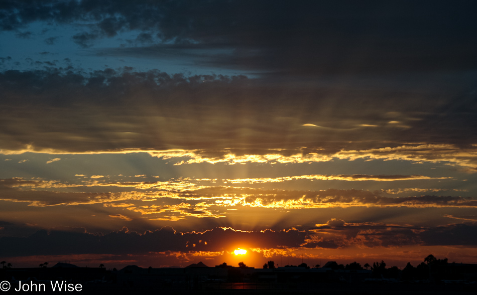 Sunset over Phoenix, Arizona with the days getting shorter but the temperature staying high.