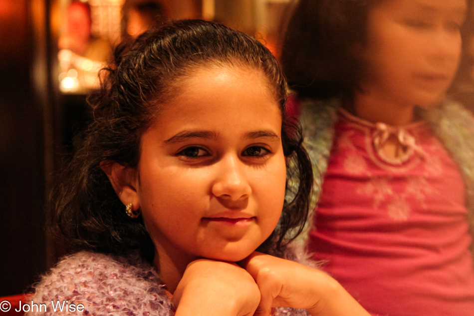 Mellisa Silva trying to wait patiently while the adults indulge in fondue at the Melting Pot in Tucson, Arizona