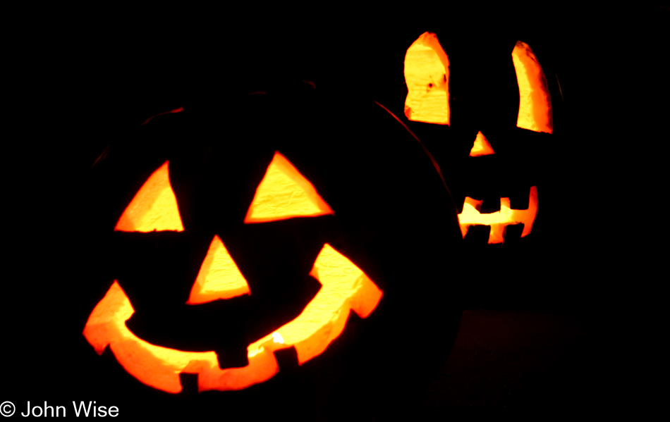 Two pumpkins sitting curbside, welcoming kids to stop by for a treat in Phoenix, Arizona