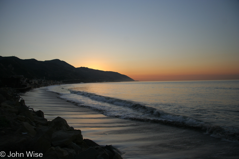 Near Seacliff south of Santa Barbara we stopped at dawn along the Pacific coast for this gorgeous orange slice of sunrise sandwiched between a light blue sky and the still dark ocean