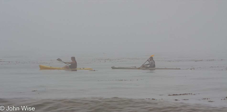 Kayakers in the fog in Santa Barbara, California