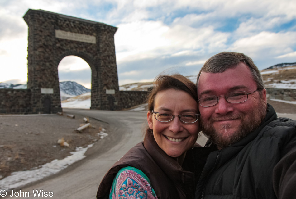 Caroline Wise and John Wise at the Roosevelt Arch in Yellowstone National Park, Montana