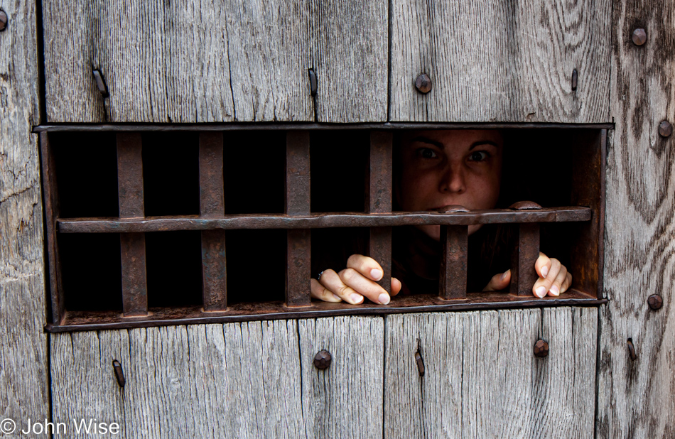 Jessica Aldridge behind bars in Colonial Williamsburg, Virginia
