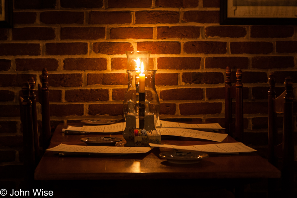 A candle lit table at Shields Tavern in Colonial Williamsburg, Virginia