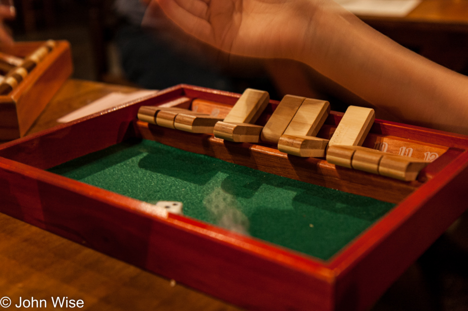 Playing Shut the Box game at Chowning's Tavern in Colonial Williamsburg, Virginia