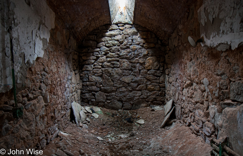 Inside a crumbling jail cell at Eastern State Penitentiary in Philadelphia, Pennsylvania