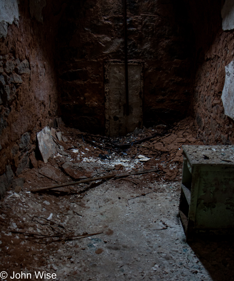 Inside a crumbling jail cell at Eastern State Penitentiary in Philadelphia, Pennsylvania