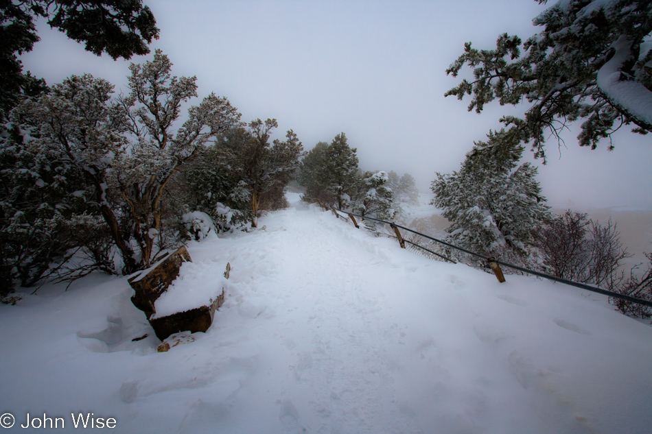 On the snowy Rim Trail at the Grand Canyon National Park on December 12, 2009