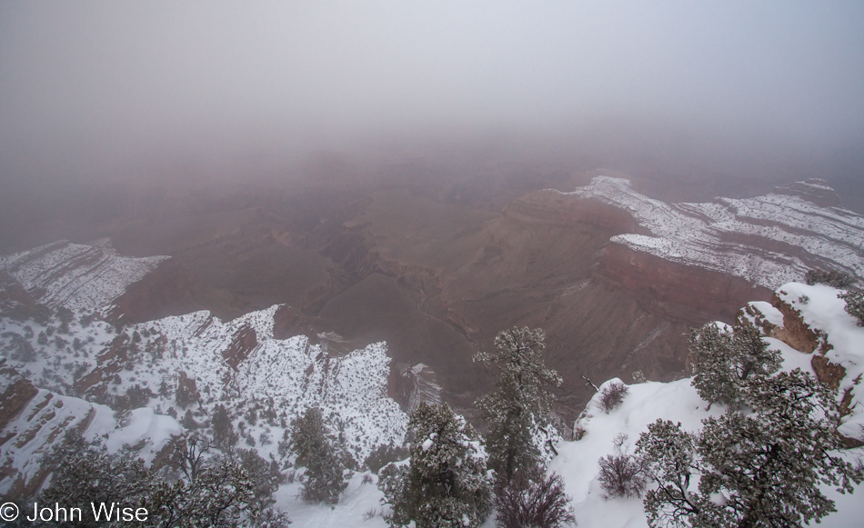 Late afternoon view into a foggy and snowy Grand Canyon on December 12, 2009