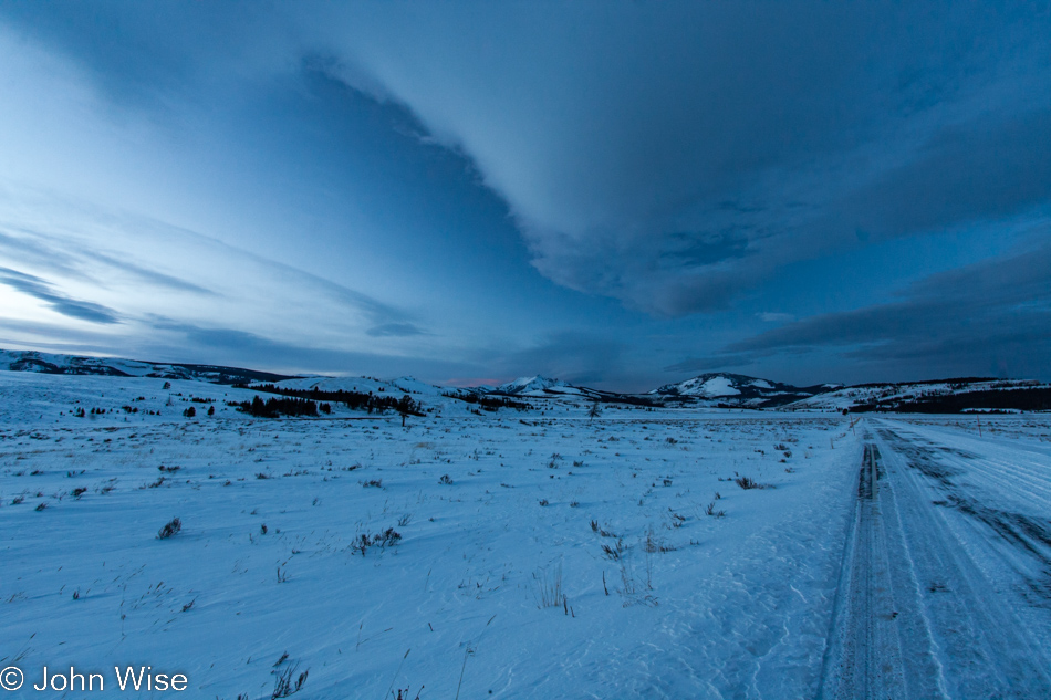 Electric Peak in the distance under a blue dusk sky in Yellowstone National Park January 2010