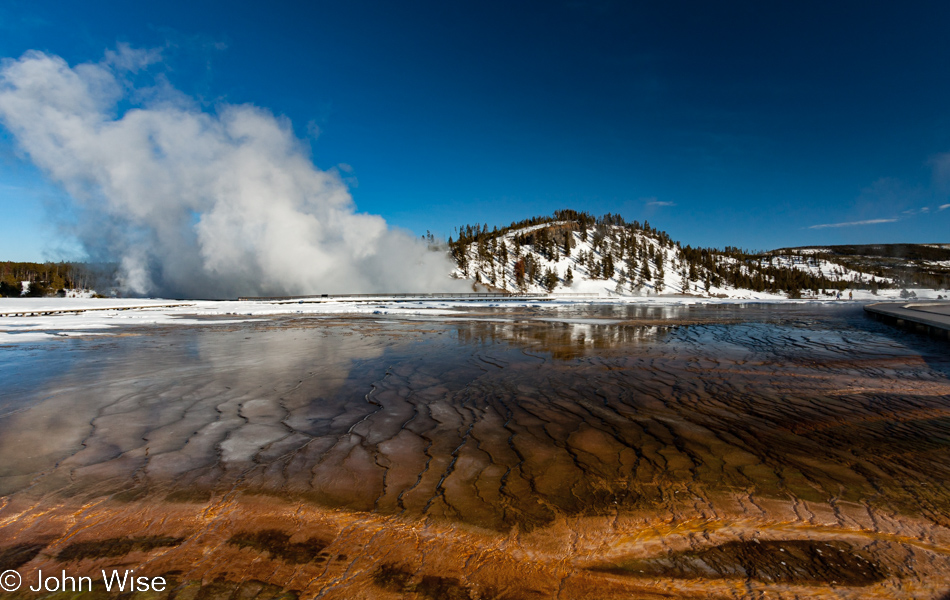 Water from Grand Prismatic Spring flowing towards Excelsior Geyser on the Midway Geyser Basin in Yellowstone National Park January 2010