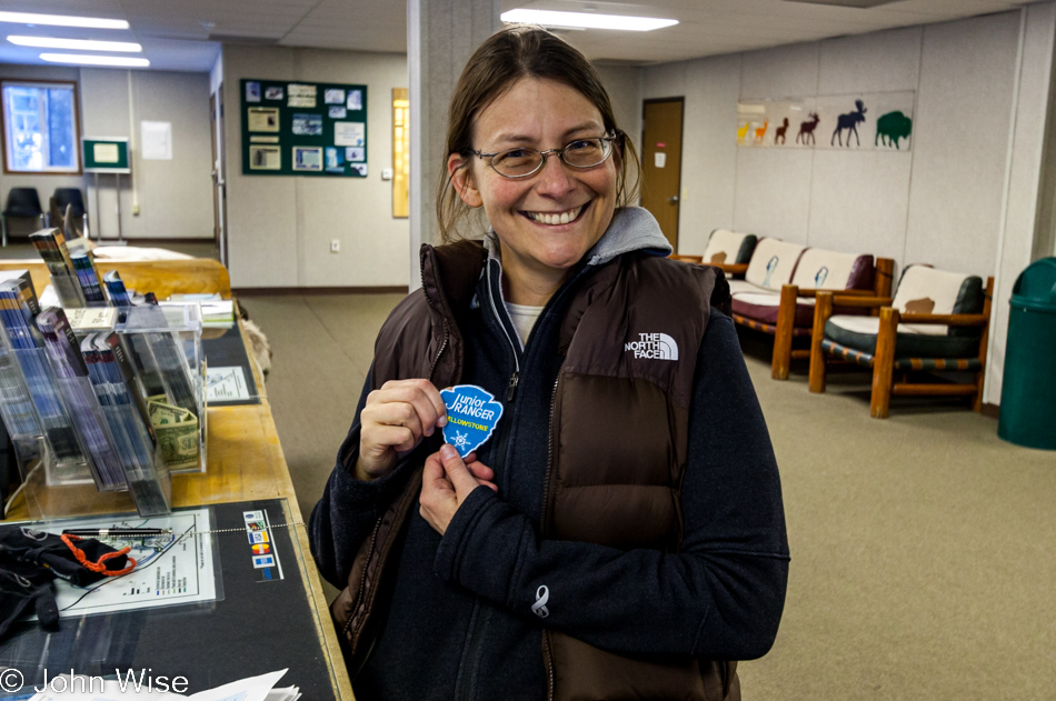 Caroline Wise holding her Junior Ranger Snow Patch from Yellowstone National Park January 2010