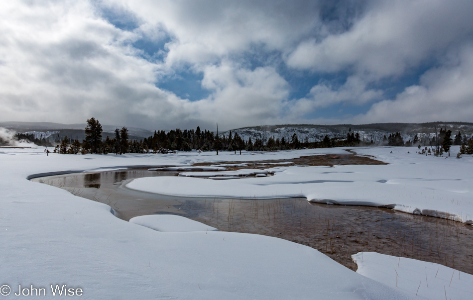 Warm water and snow on the Upper Geyser Basin in Yellowstone National Park January 2010