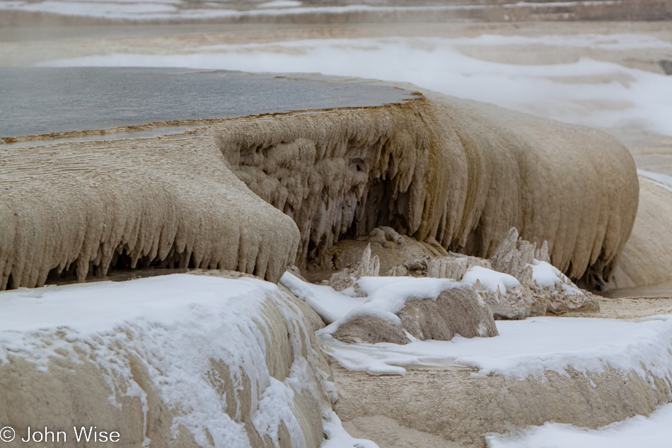 Travertine sculpted edge of a hot spring pool at Mammoth Hot Springs in Yellowstone National Park January 2010