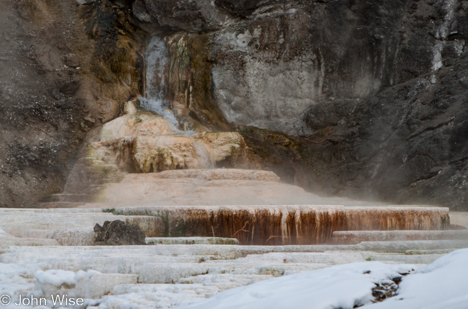 Water gushing from rock forming new terraces at Mammoth Hot Springs in Yellowstone National Park January 2010