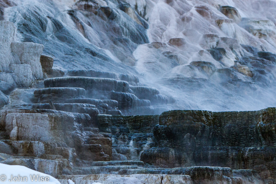 Steaming hill side terraces at Mammoth Hot Springs in Yellowstone National Park January 2010