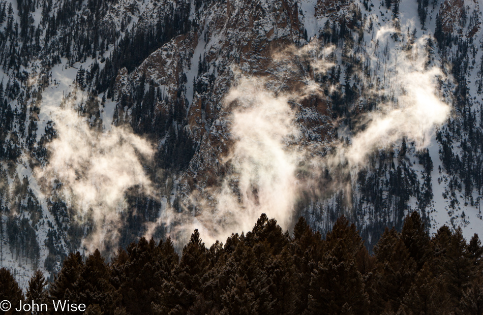 Clouds rising off the forest in front of Golden Gate and Bunsen Peak in Yellowstone National Park January 2010