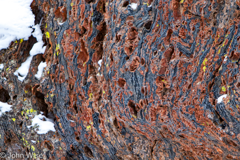 Obsidian glass layered between rock at Obsidian Cliff in Yellowstone National Park January 2010