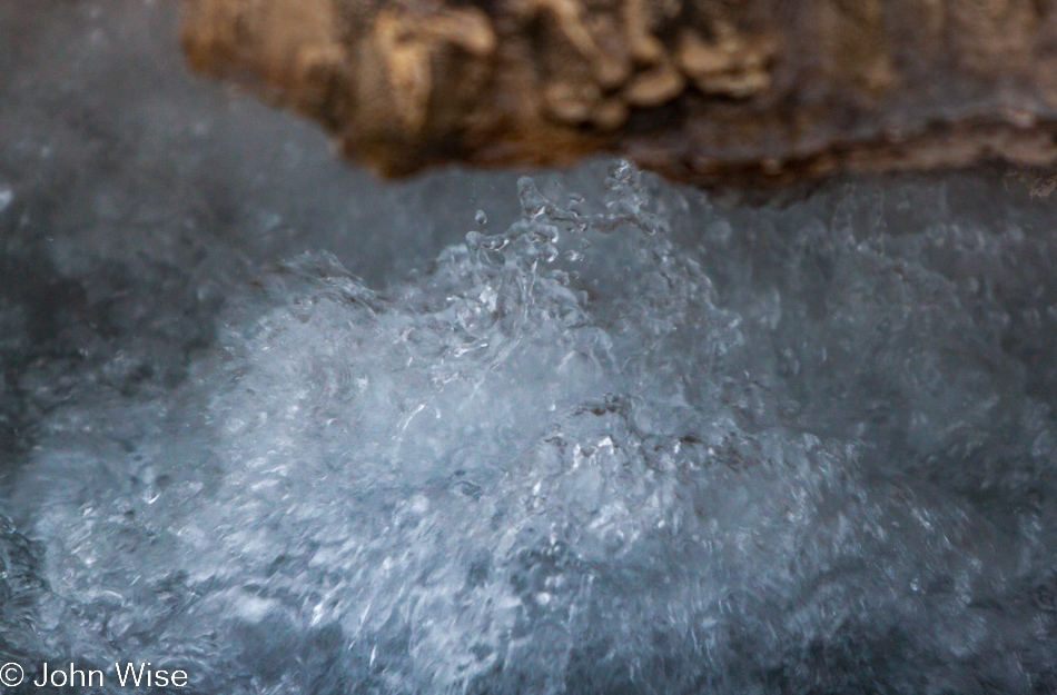 Closeup of boiling water in an unnamed small geyser on the Upper Geyser Basin in Yellowstone National Park January 2010