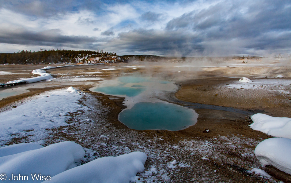 Hot Spring and boardwalk at Porcelain Basin part of the Norris Geyser Basin in Yellowstone National Park January 2010