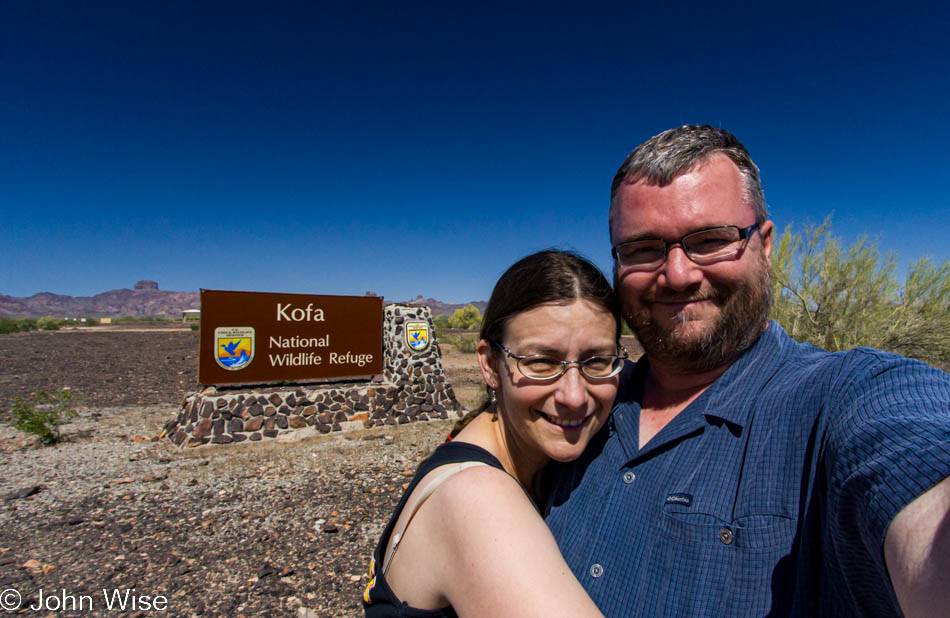 Caroline Wise and John Wise in front of the Kofa National Wildlife Refuge sign in western Arizona