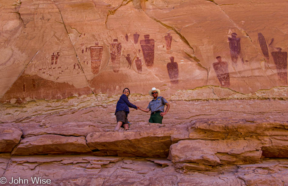 Caroline Wise and Ranger Nate on the ledge of the Great Gallery in Horseshoe Canyon at Canyonlands National Park in Utah
