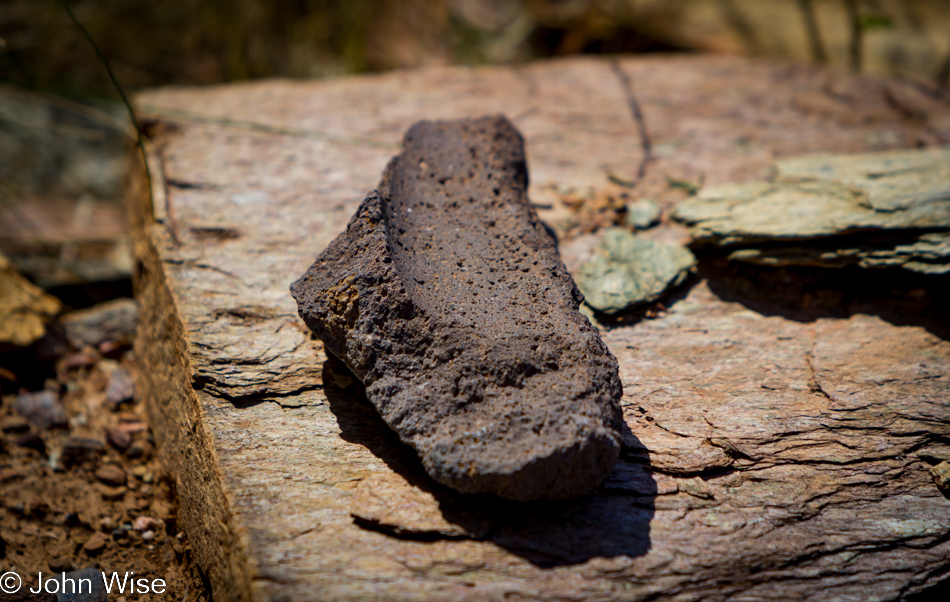 Fragment of a broken metate near a Native American ruin site not far from Prescott, Arizona
