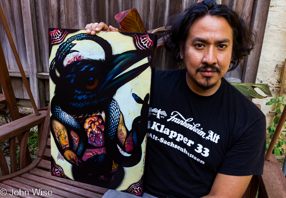 Artist Dion Terry holding his most recent work, Pillow Talking The Devil - photo taken in San Diego, California on October 1, 2010