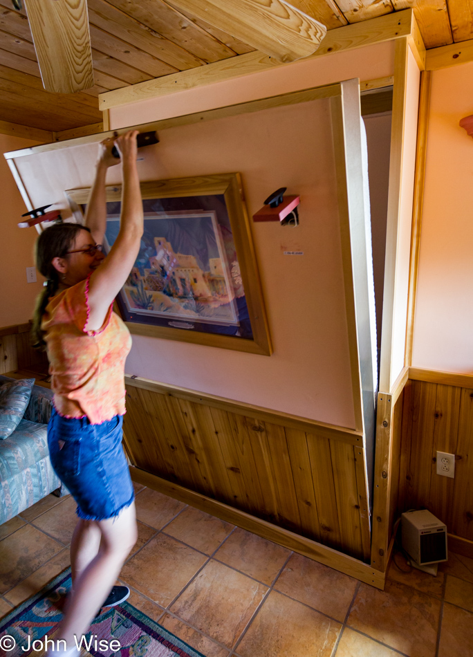 Caroline Wise pulling down our Murphy Bed at Five Branches Camper Park on Vallecito Reservoir in Bayfield, Colorado