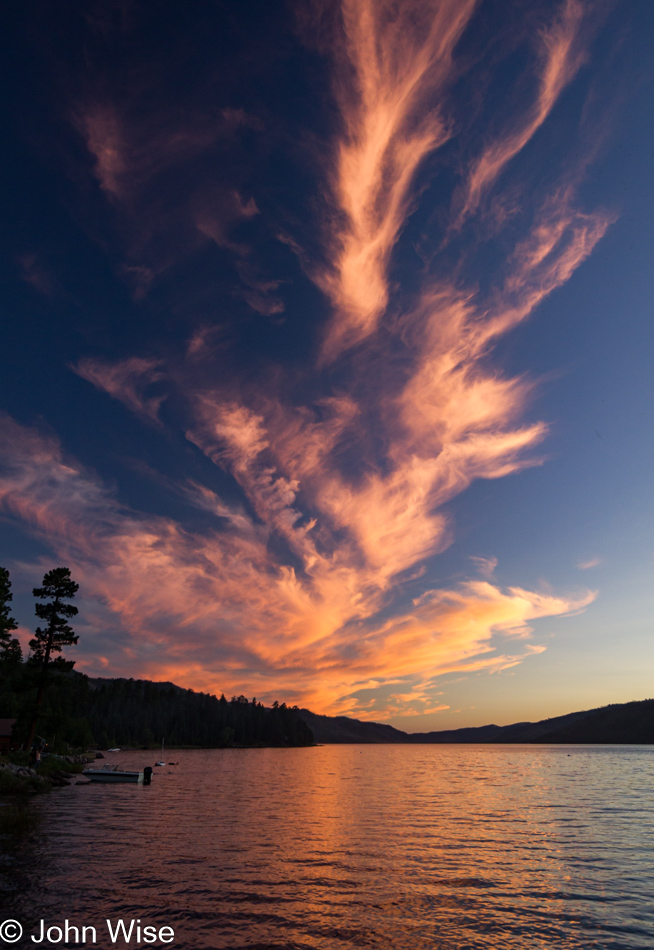 A sunset created sky flame made of clouds over Vallecito Reservoir in Bayfield, Colorado