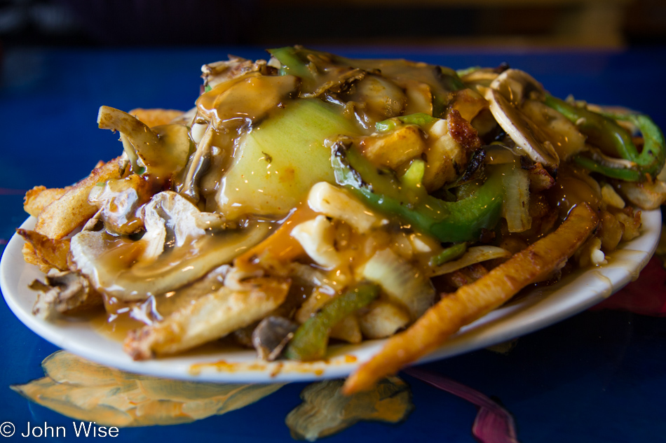 Poutine with mushrooms, onions, green peppers from La Banquise in Montreal, Canada