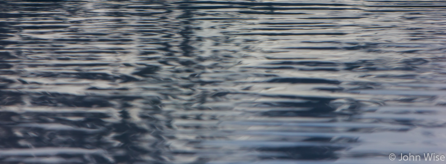 Out on Alsek Lake in Alaska looking at the reflections on the beautifully rippling water