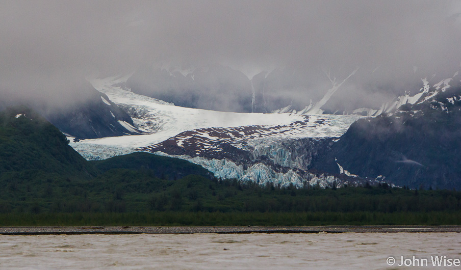 Glaciers fall out of the mountains like cactus grow out of the desert. Next to the Alsek River in Alaska
