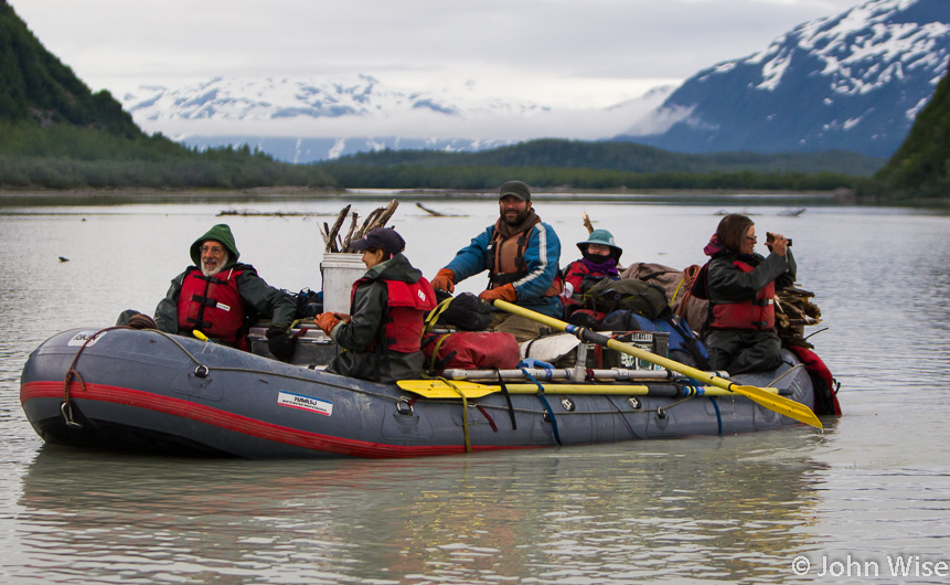 Exiting Door Number 3 is Shaun Cornish and his raft full of travelers. On Alsek Lake in Alaska